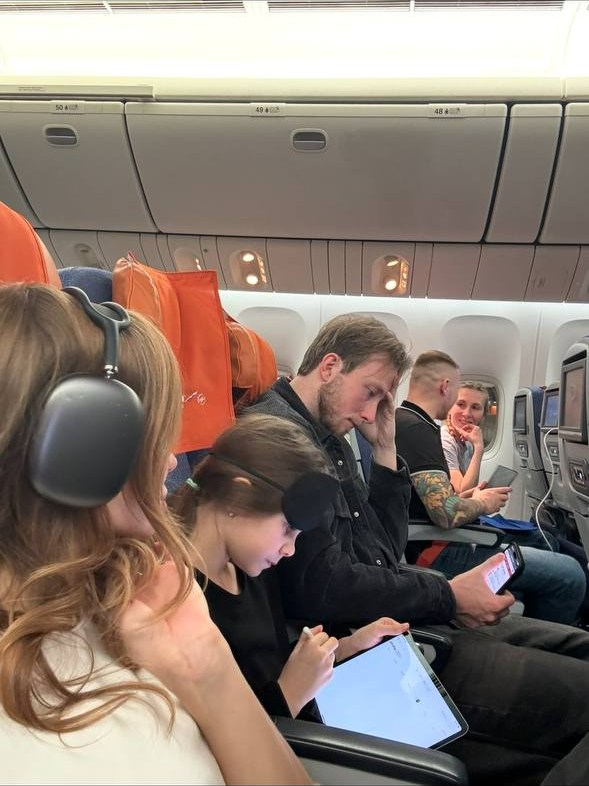 Gustaf and Valeriia traveling together on a flight